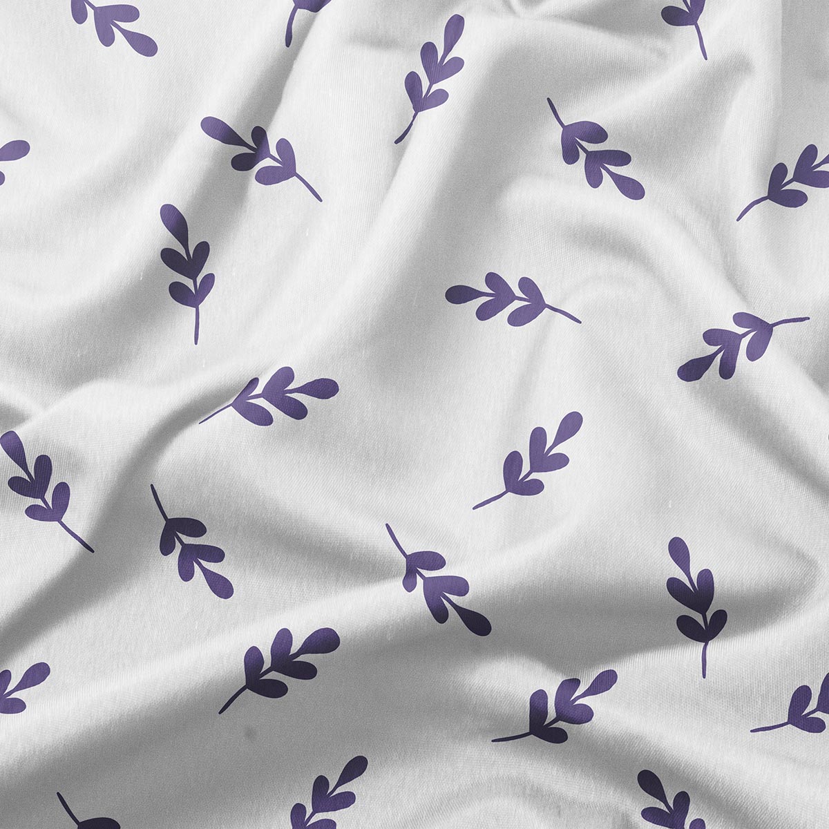 zbliżenie materiału i detalu wzoru z pojedynczymi fioletowymi gałązkami