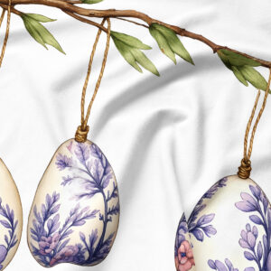 detal akwarelowej pisanki z fioletowym dekoracyjnym wzorem wiszącej na gałązce