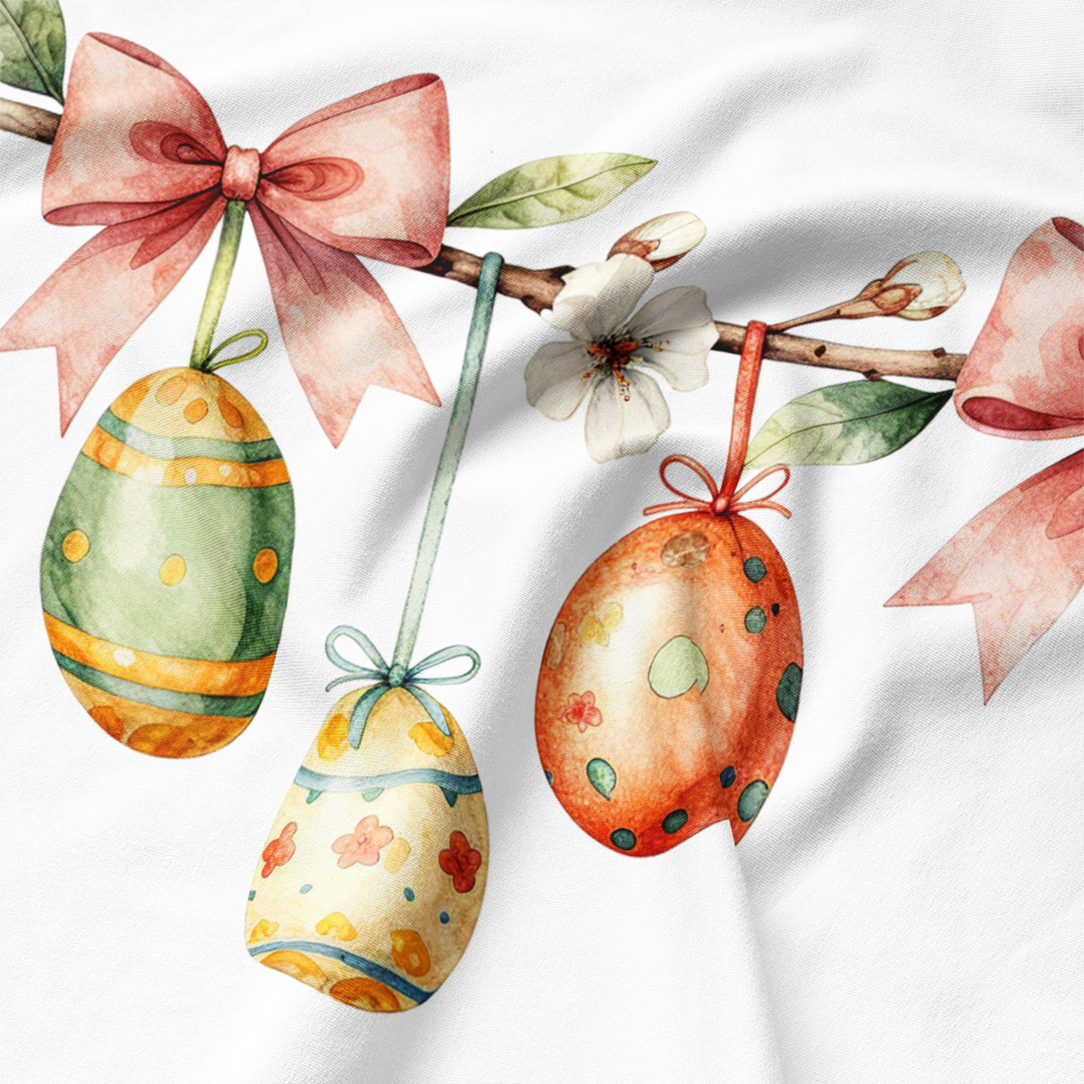 detal: akwarelowe pisanki w pastelowych kolorach wiszące na gałązce z kokardą