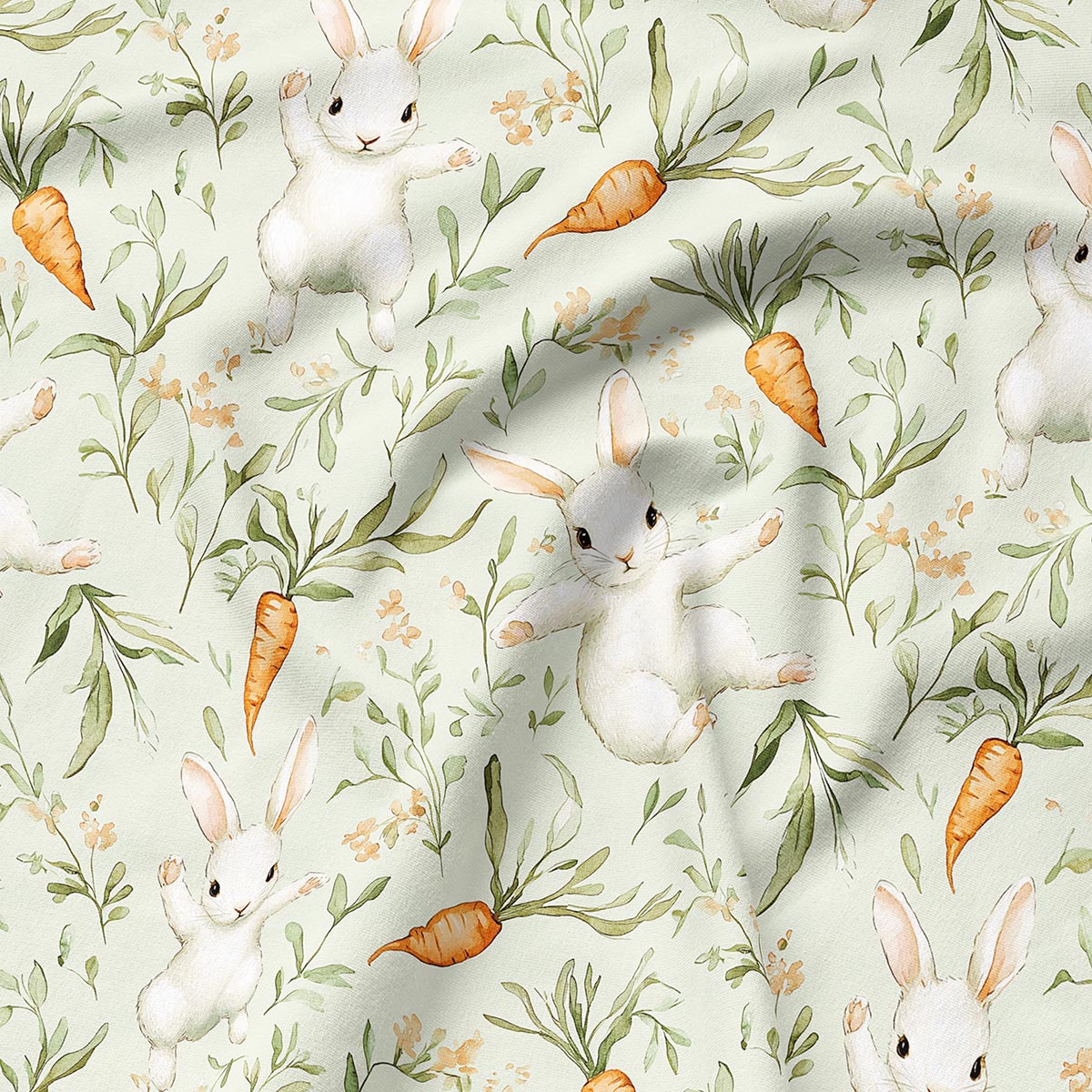 Zbliżenie detalu tkaniny z akwarelowymi zajączkami, marchewkami i delikatnymi gałązkami