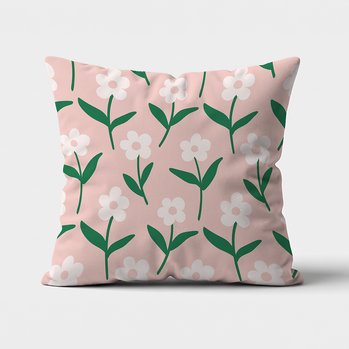 Kwadratowa poduszka dekoracyjna z różowym tłem i wzorem białych stokrotek na neutralnym tle