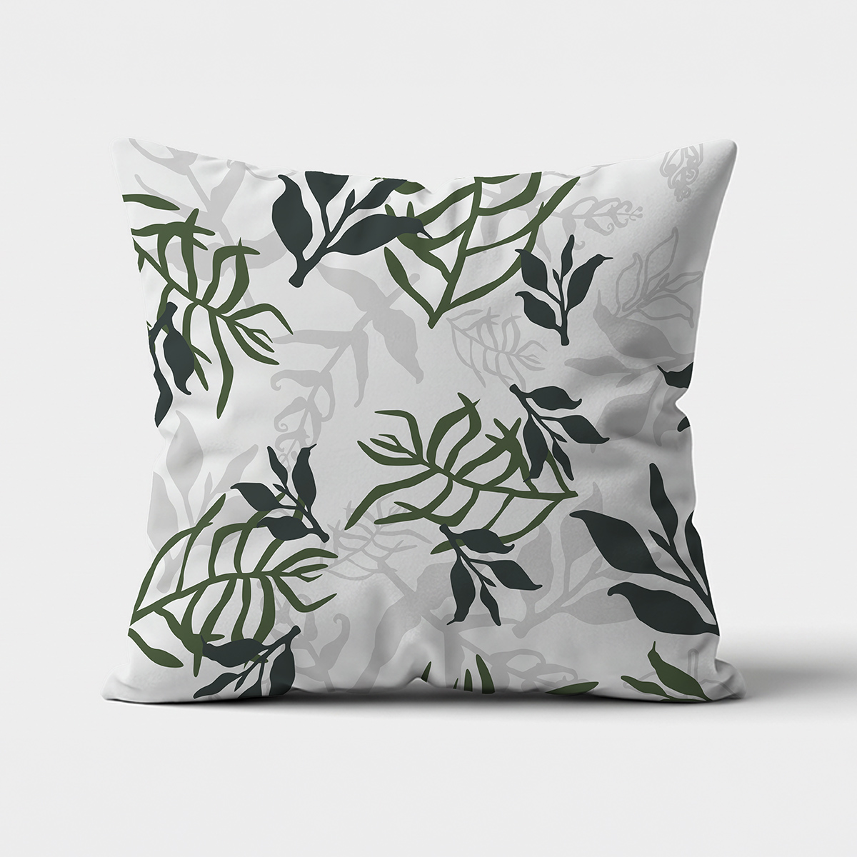 Główne ujęcie poduszki z liściastym wzorem na jasnym tle