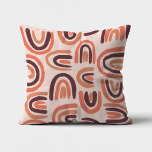 Główne ujęcie poduszki z wzorem łuków w ciepłych, ziemistych odcieniach na jasnym tle