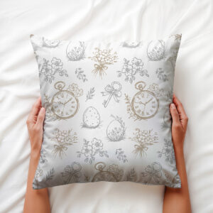 Zbliżenie na poduszkę trzymaną w dłoniach, widoczne detale zegarków i bukiecików