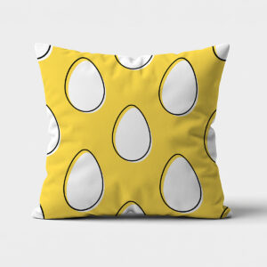 Przód poduszki na białym tle z żółtym tłem i dużymi białymi pisankami z czarną obwódką
