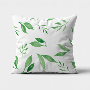 biała poduszka z zielonymi akwarelowymi listkami na przodzie