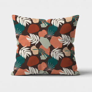 Główne ujęcie poduszki dekoracyjnej z liściastym wzorem i organicznymi plamami