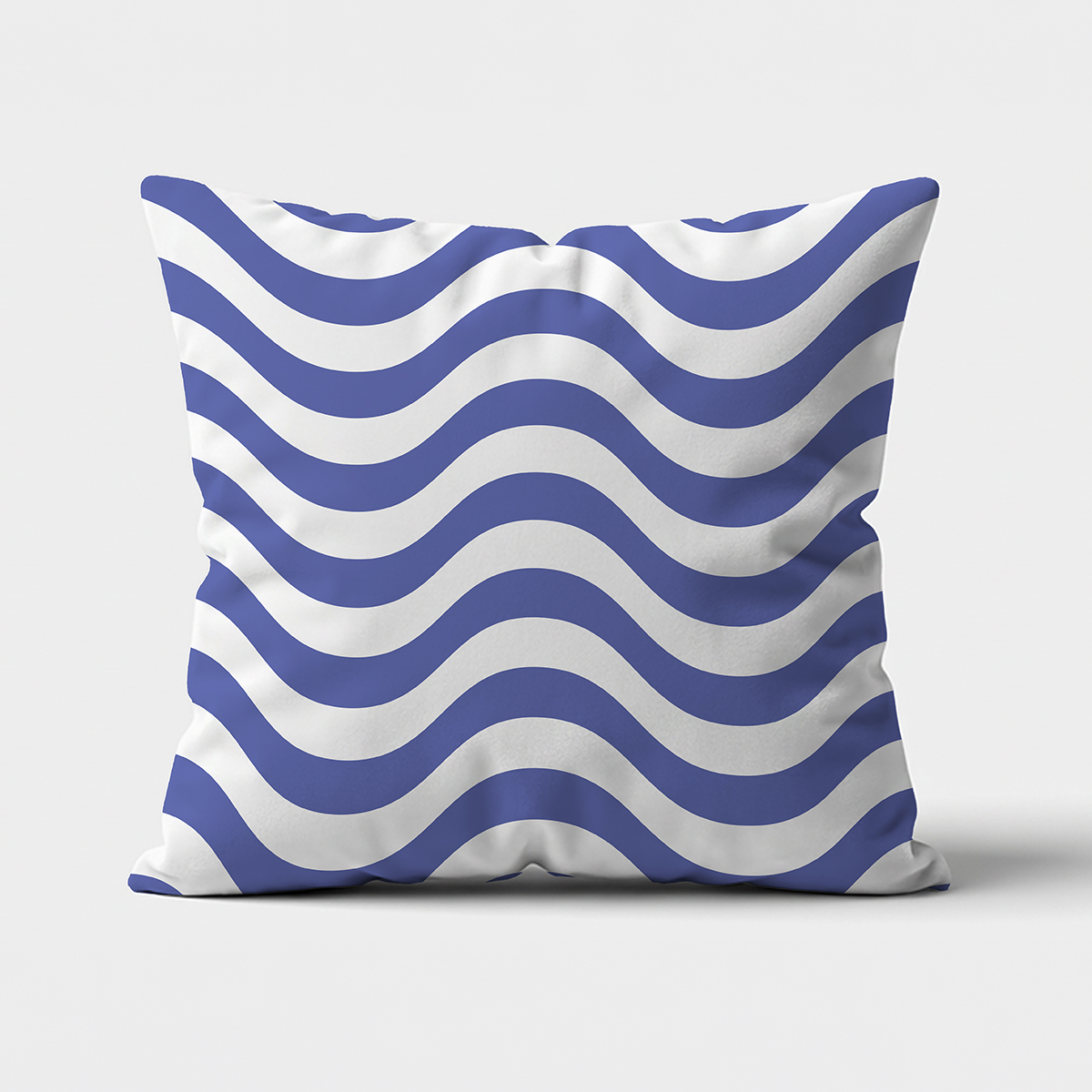Główne ujęcie poduszki z falistym niebieskim wzorem na białym tle