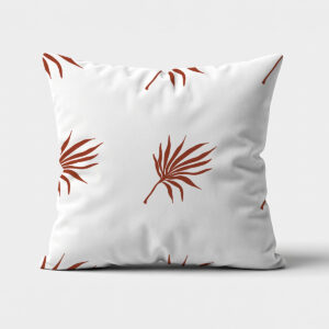 poduszka ozdobna na białym tle z rdzawym motywem palmowych liści — główne ujęcie