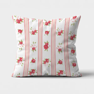 Główne ujęcie poduszki dekoracyjnej z różowymi pionowymi pasami i drobnymi czerwonymi różyczkami na białym tle