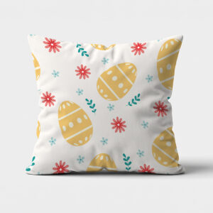 poduszka z wzorem złotych jajek i drobnych kwiatów na jasnym tle, widok z przodu