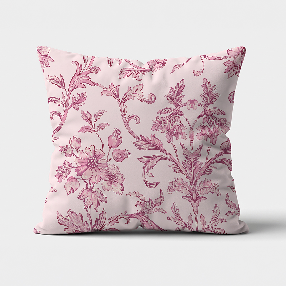 frontalne ujęcie poduszki z różowym ornamentem kwiatowym na jasnym tle