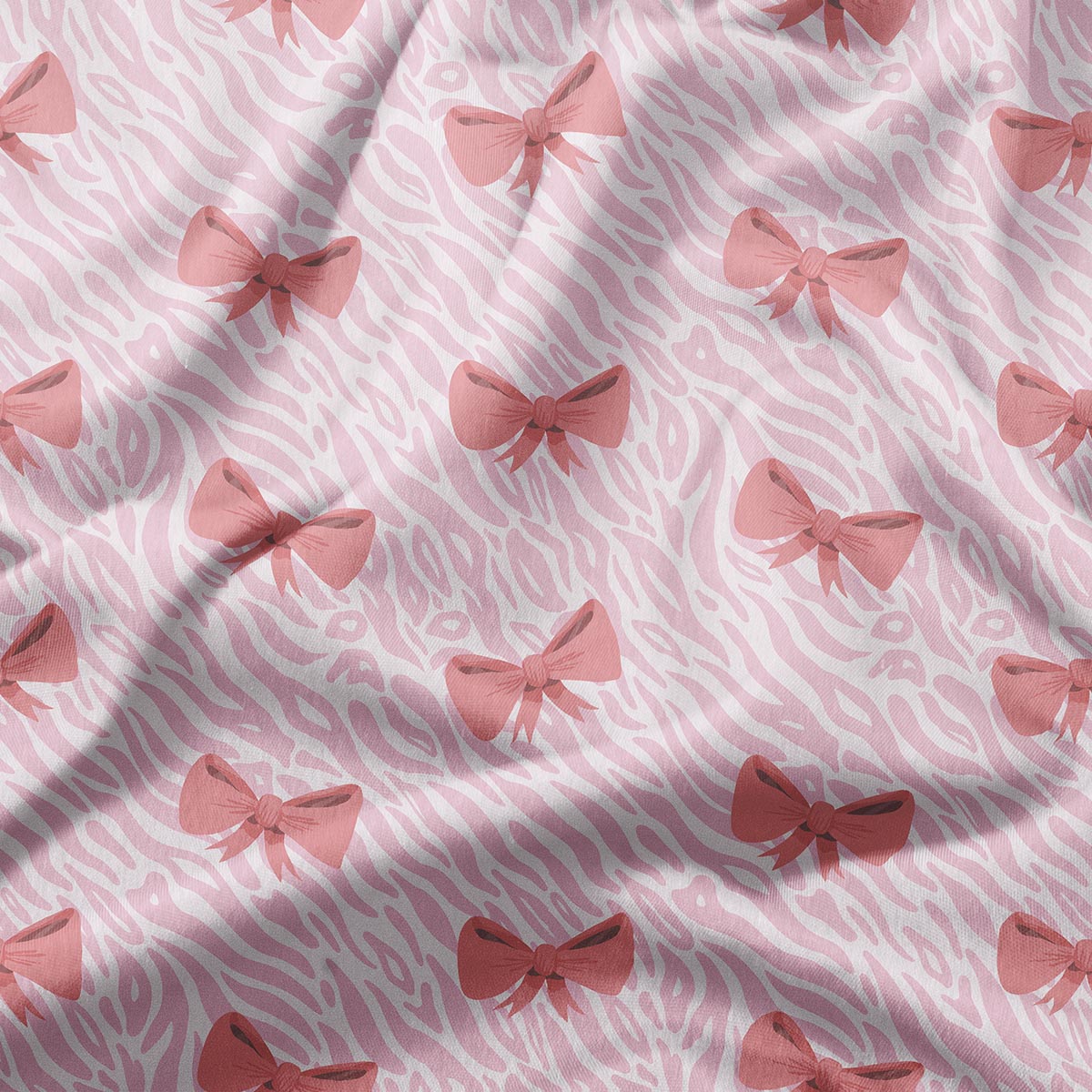 zbliżenie na tkaninę z różowymi kokardkami i subtelnym falistym tłem