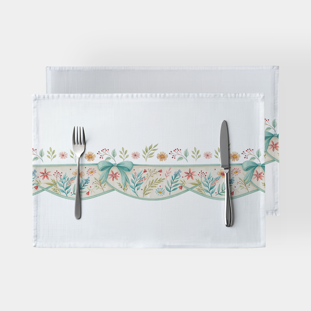 Podkładka stołowa z motywem kokard i delikatnych kwiatów na białym tle — ujęcie główne