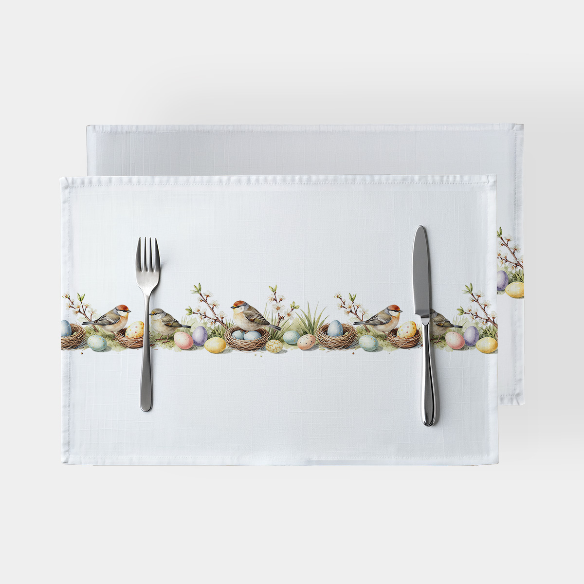 biała podkładka stołowa z poziomym pasem ilustracji ptaków, gniazdek i pastelowych pisanek