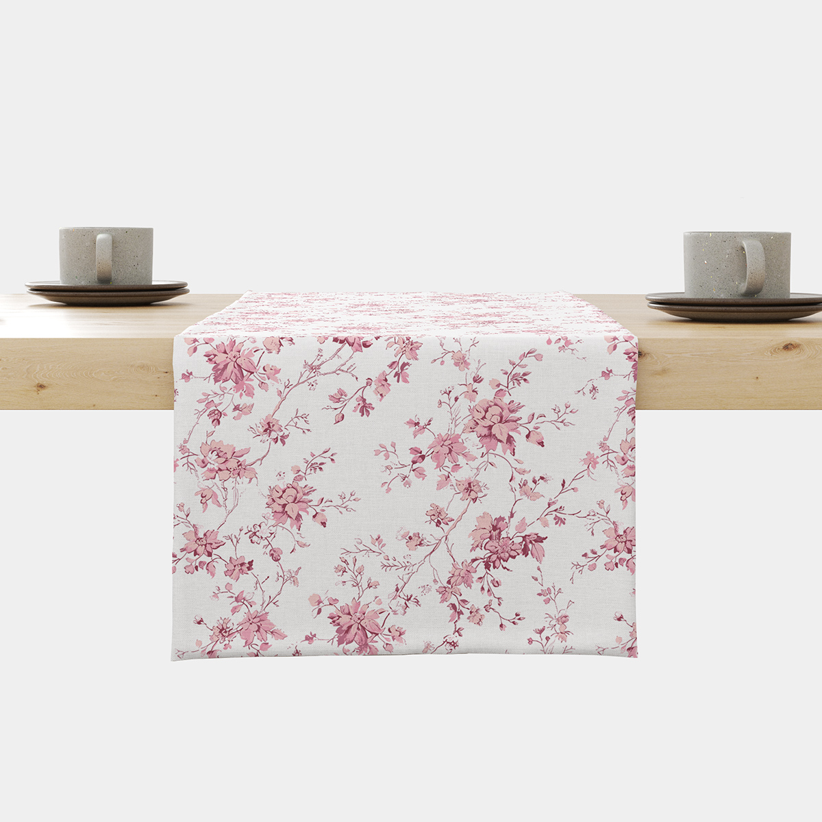 bieżnik z różowymi gałązkami rozłożony na stole, widok z przodu