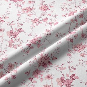 zbliżenie na tkaninę i detal różowych kwiatów na jasnym tle