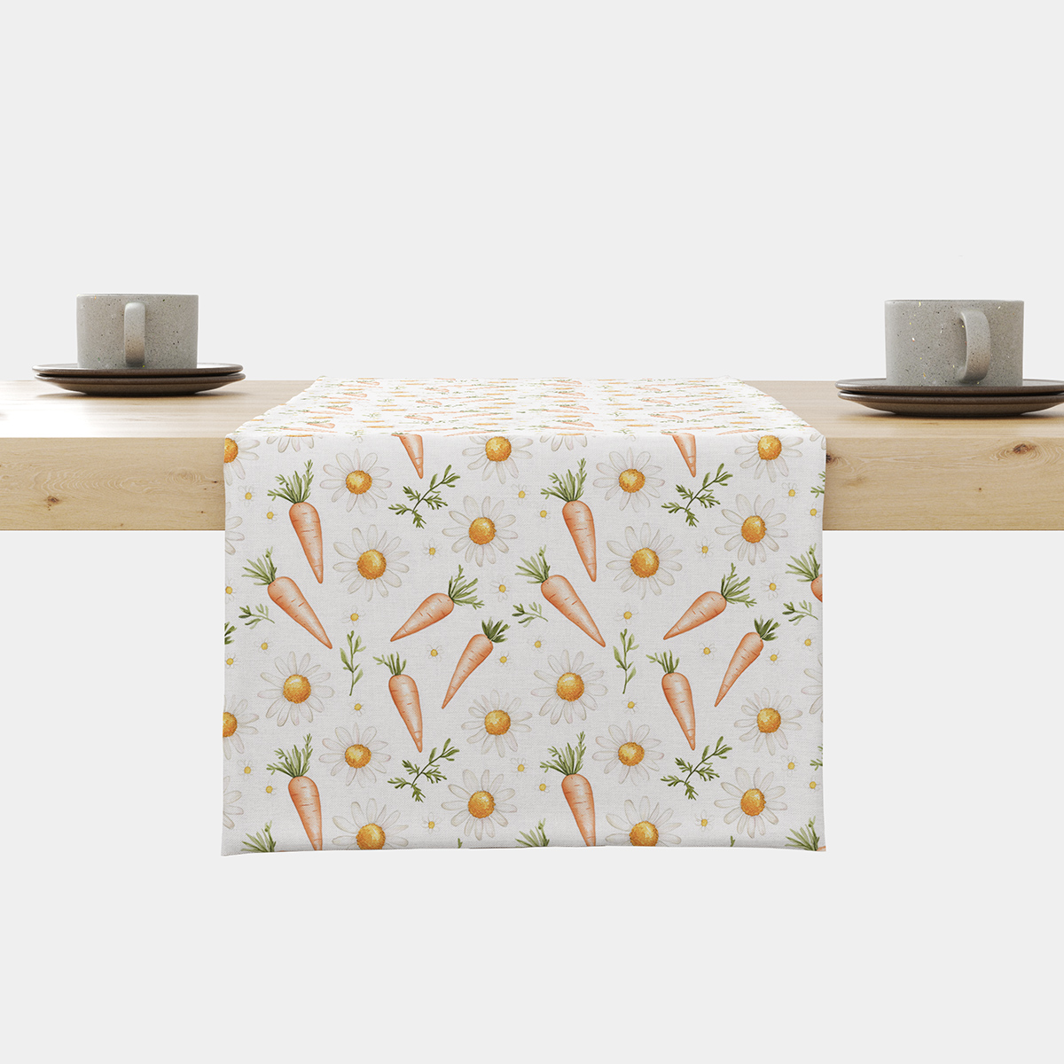 Bieżnik z motywem marchewek i stokrotek ułożony na stole - główne ujęcie