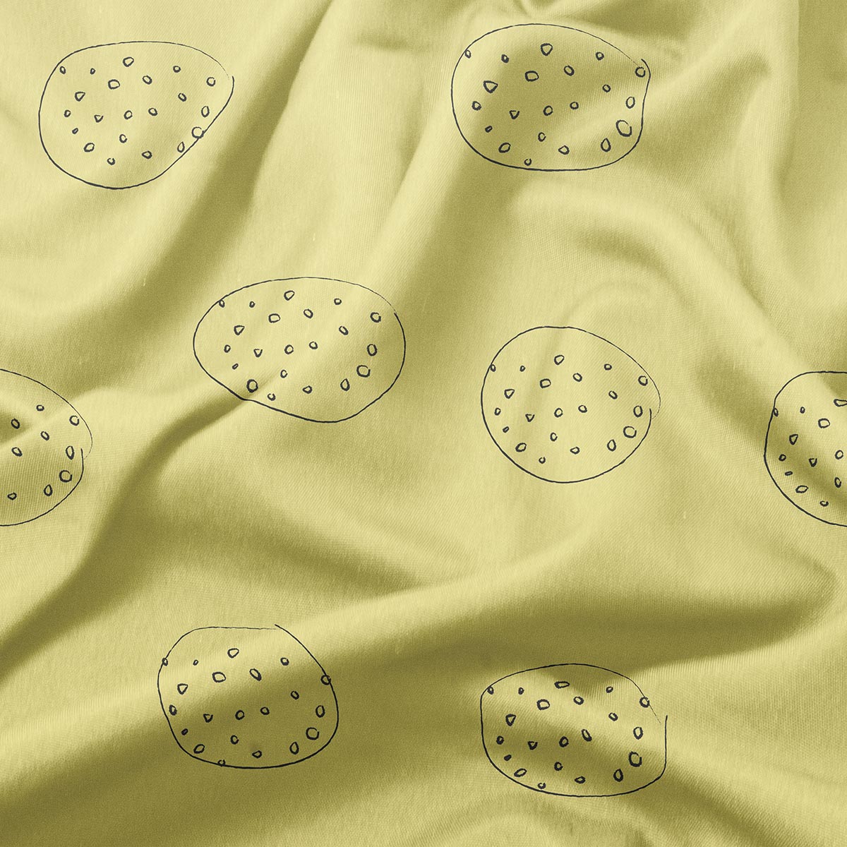 detal tkaniny z rysunkowymi okręgami wypełnionymi drobnymi kropeczkami