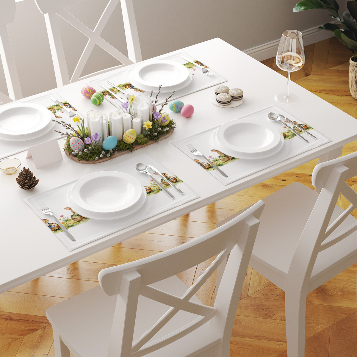 Stół zastawiony kilkoma podkładkami z motywem zajączków, widok aranżacyjny z elementami wielkanocnej dekoracji