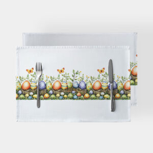 biała podkładka z pasem kolorowych pisanek, gniazdek i motylków widok z góry z sztućcami