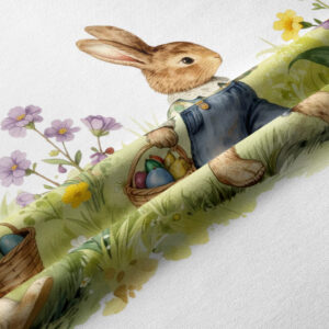 zbliżenie na ilustrowanego zajączka i koszyk z kolorowymi pisankami na tkaninie