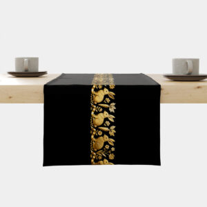Czarny bieżnik na stole z centralnym pasem złotych królików i marchewek