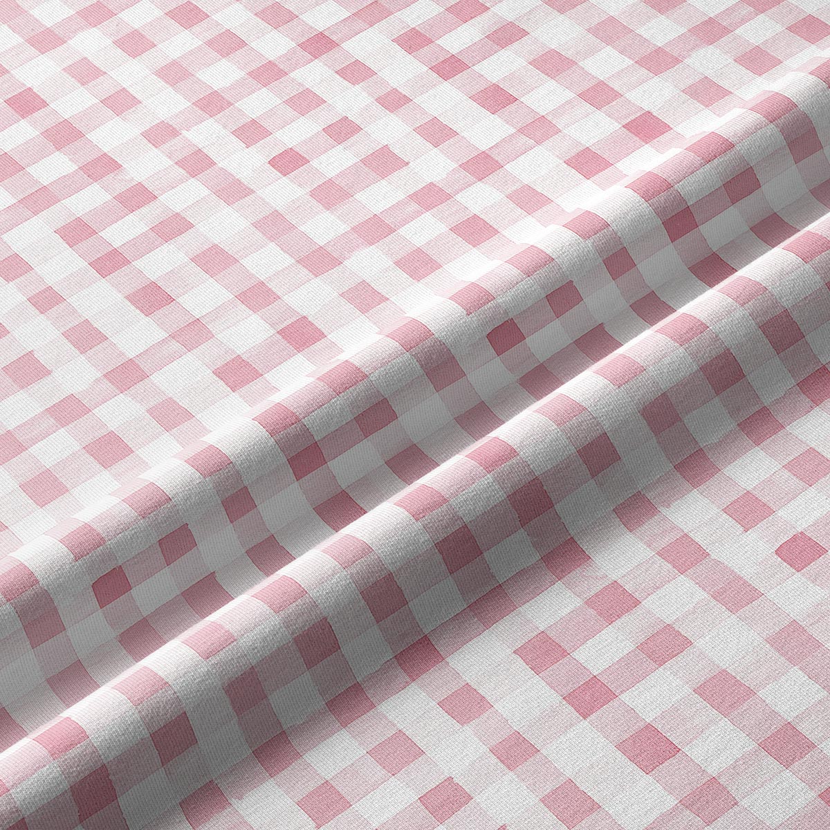 Zbliżenie na fakturę tkaniny i drobną kratkę w pastelowym odcieniu różu
