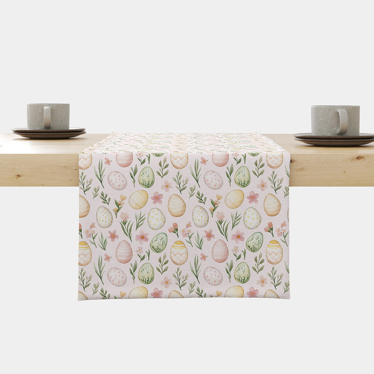 Bieżnik na stole z motywem pastelowych pisanek i wiosennych gałązek, ujęcie frontalne