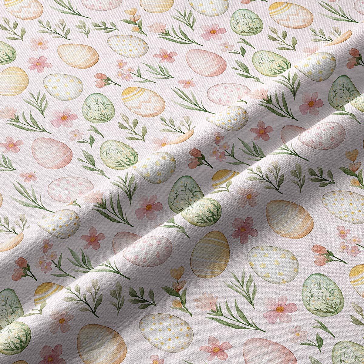 Zbliżenie na tkaninę z akwarelowymi pisankami i drobnymi kwiatami