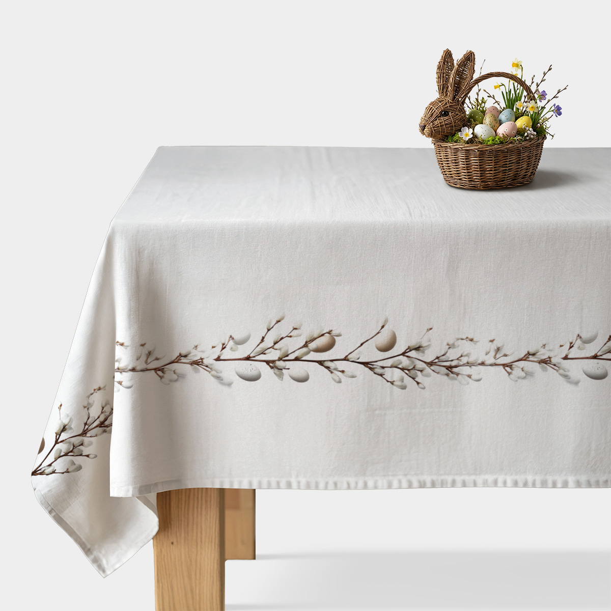 obrus z motywem bazi i pisanek na jasnym stole, widok główny