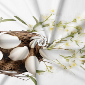 detal nadruku pokazujący gniazdo z białymi jajkami i delikatne kwiaty na tkaninie