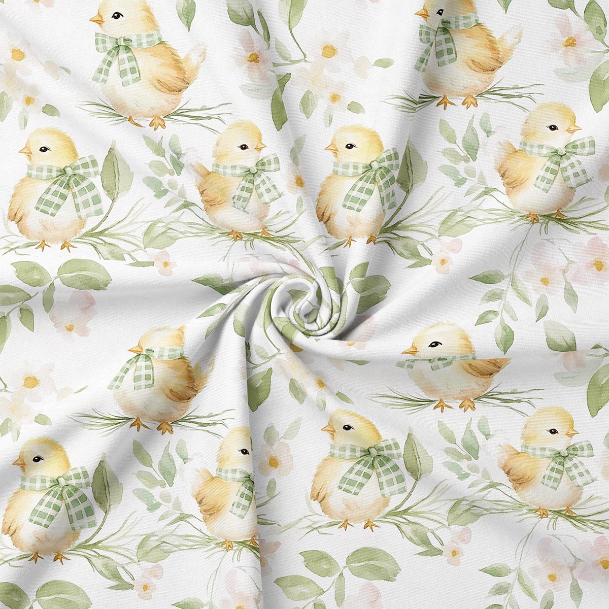 zbliżenie na tkaninę z puchatymi kurczaczkami w kratkowych apaszkach i zielonymi liśćmi