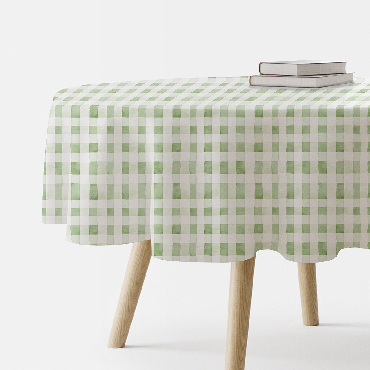 okrągły obrus z akwarelową kratką w odcieniu mięty na drewnianym stole, główne ujęcie