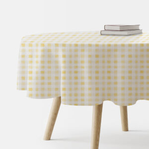 okrągły obrus na stole z żółto-białą drobną kratką