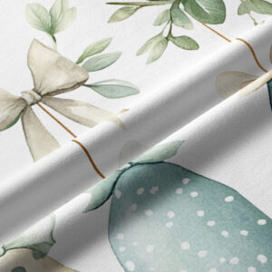 Zbliżenie na fakturę tkaniny, detal kokardy i pastelowej pisanki