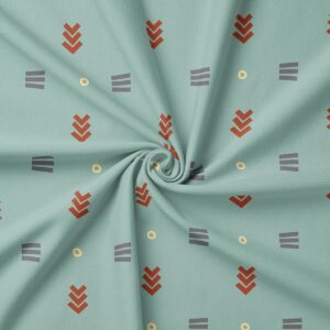 Zbliżenie tkaniny z geometrycznym wzorem pokazujące rdzawy motyw i kremowe kółka