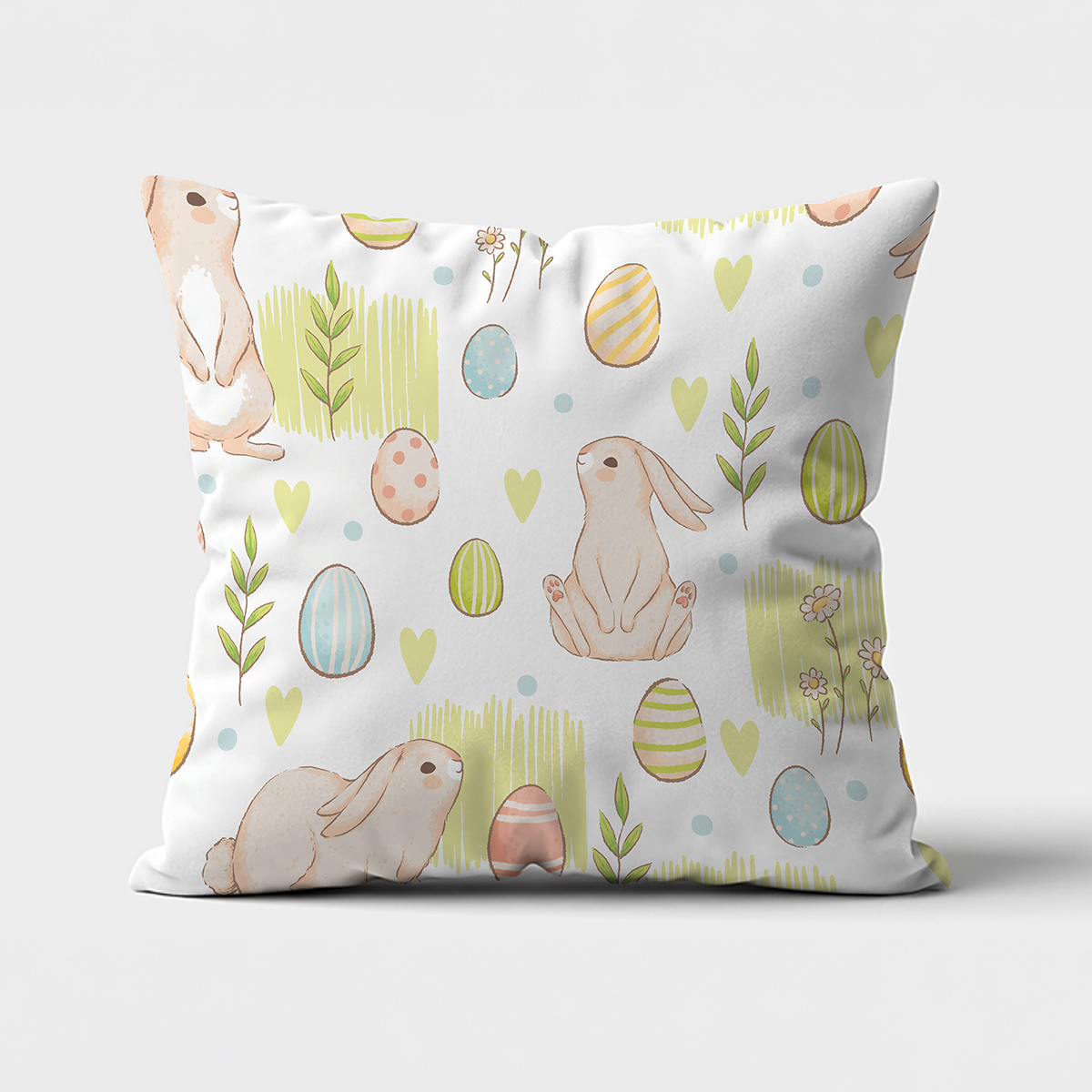 główne ujęcie poduszki z akwarelowymi zajączkami i pisankami na jasnym tle