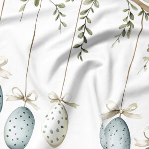 Zbliżenie detalu: akwarelowe jajka ze wstążkami i liśćmi na tkaninie