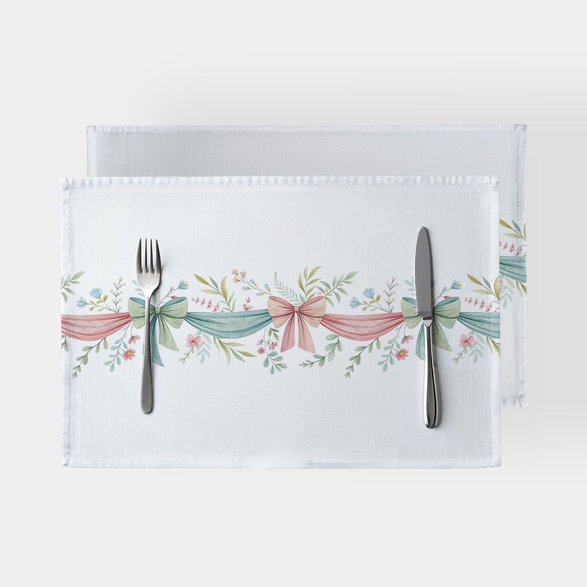 podkładka stołowa z motywem pastelowych wstążek i gałązek, ujęcie główne na białym tle
