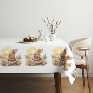 Aranżacja stołu z obrusem, dekoracyjnym koszyczkiem z jajkami i gałązkami bazi