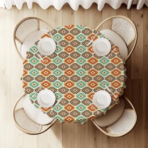 widok z góry na nakryty stół z okrągłym obrusem i ustawionymi talerzami, regularny aztecki wzór