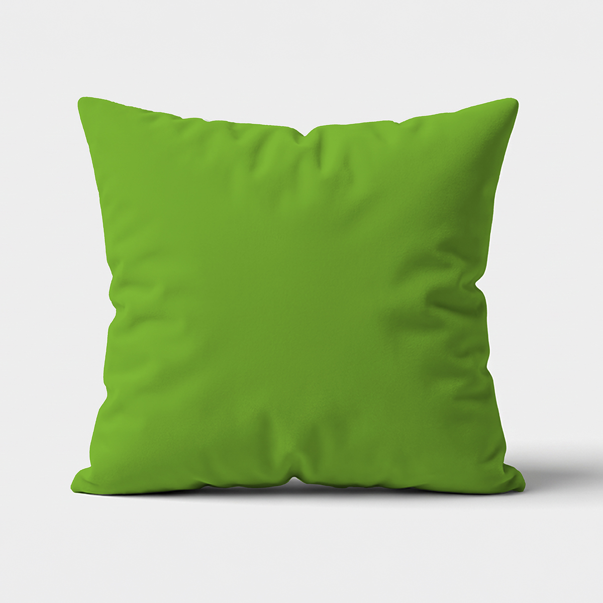 główne ujęcie gładkiej zielonej poduszki na jasnym tle