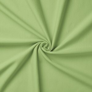 zbliżenie na strukturę zielonej tkaniny obrusowej z ułożonym skrętem materiału