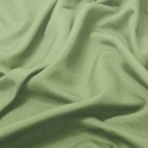 zbliżenie na fakturę gładkiego miętowego materiału obrusa