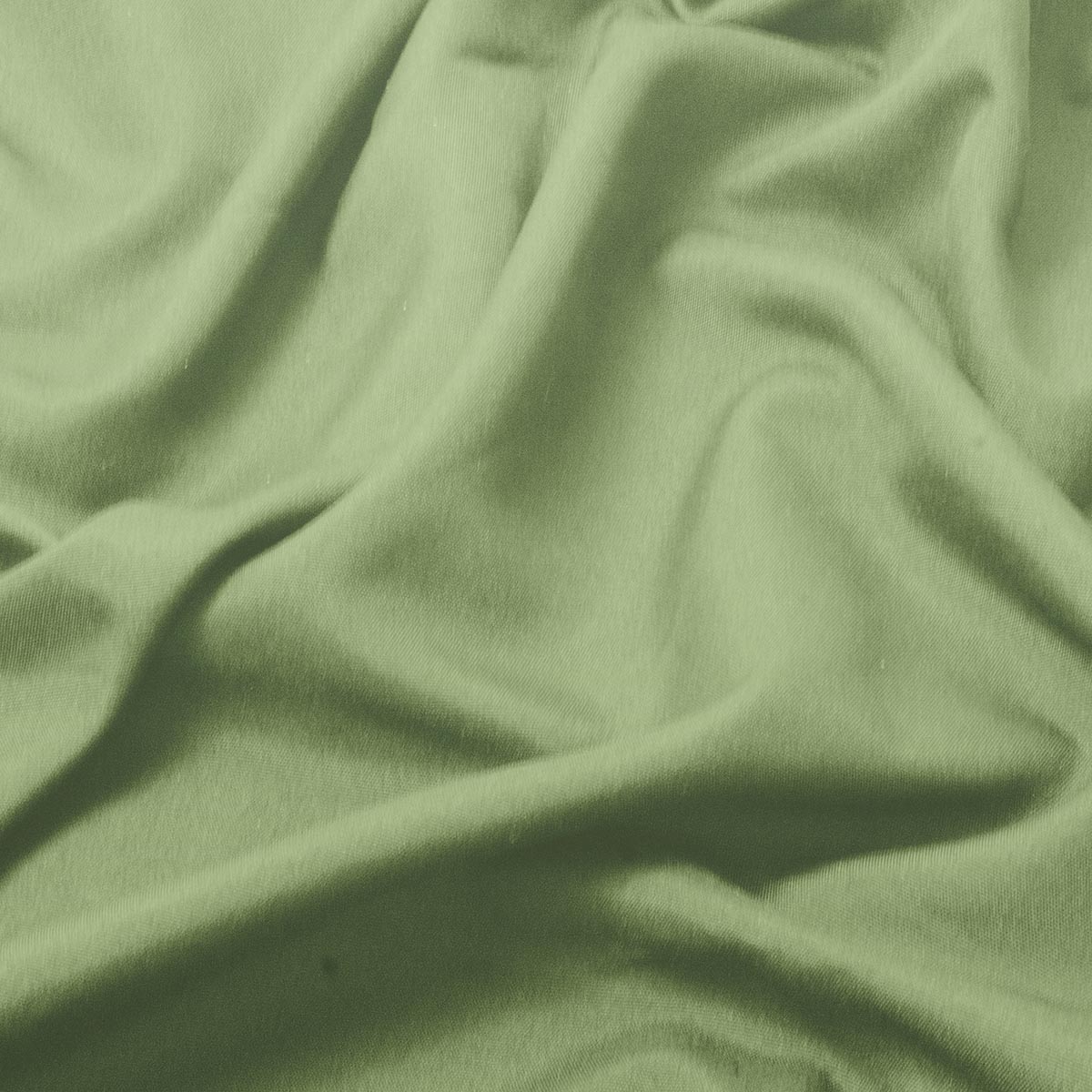 zbliżenie na fakturę gładkiego miętowego materiału obrusa