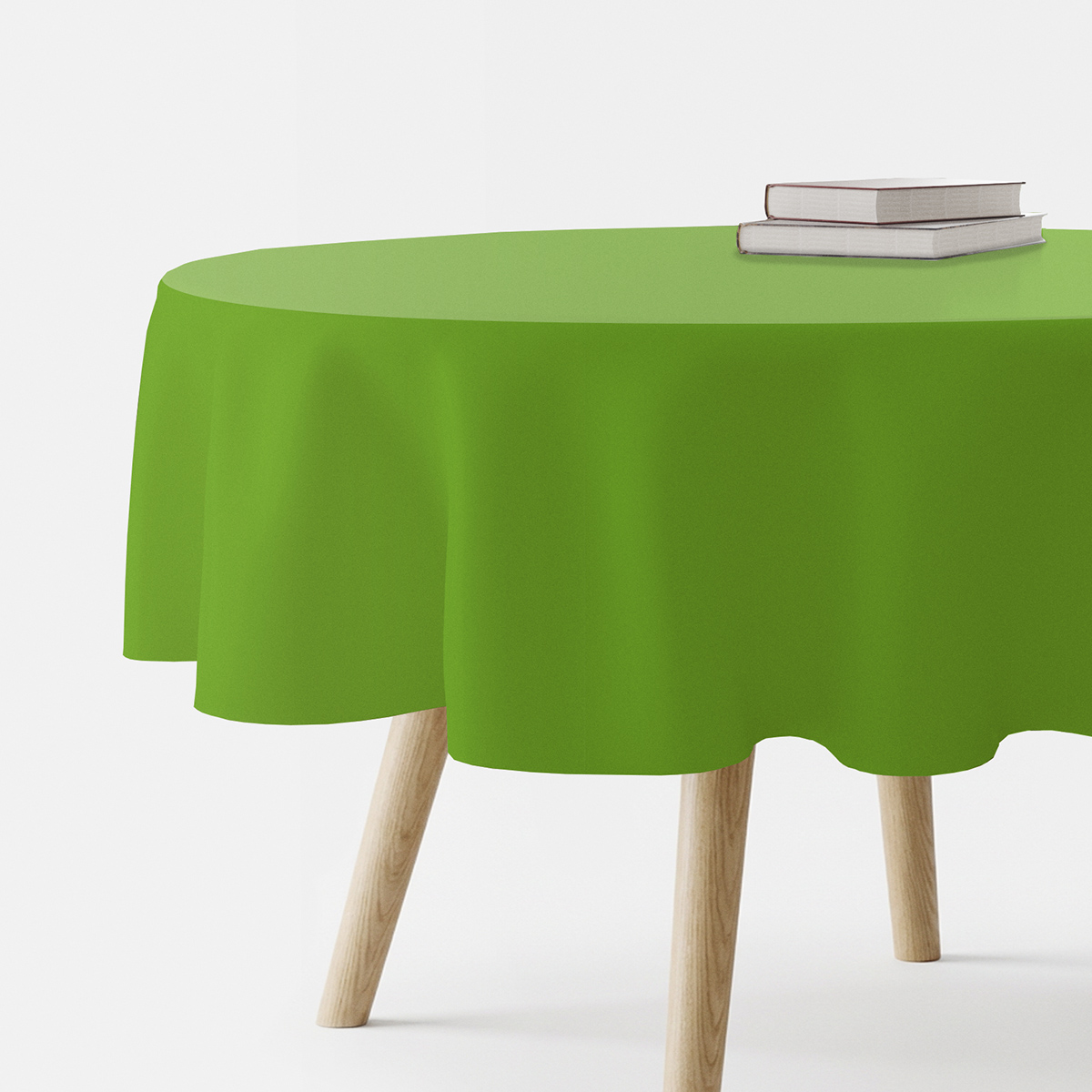 okrągły obrus w intensywnej zieleni na drewnianym stole