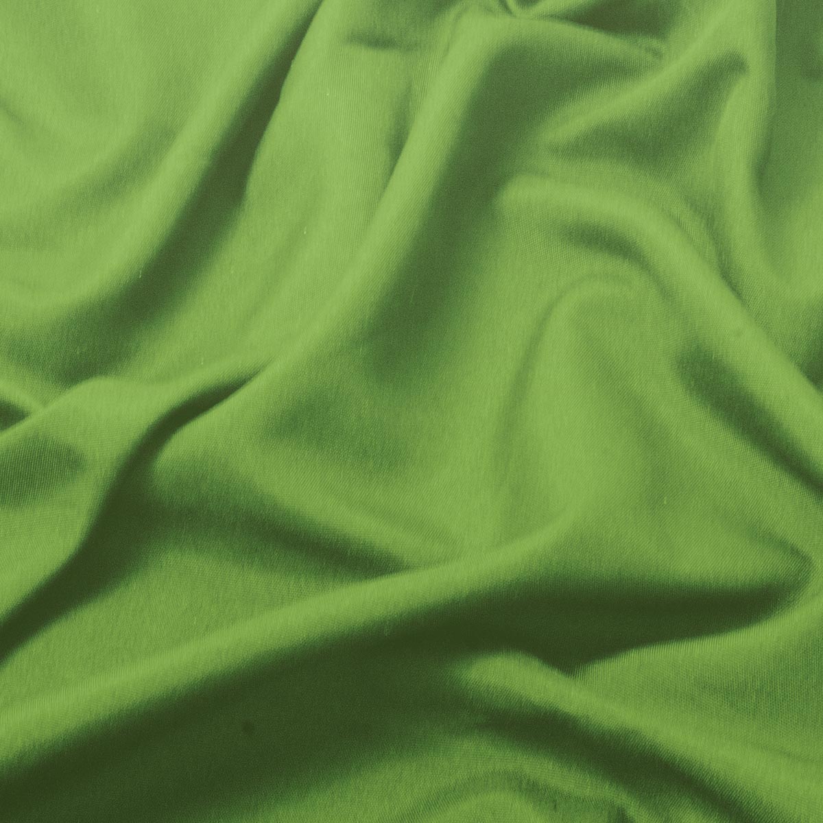 zbliżenie faktury zielonego materiału pokazujące miękki splot