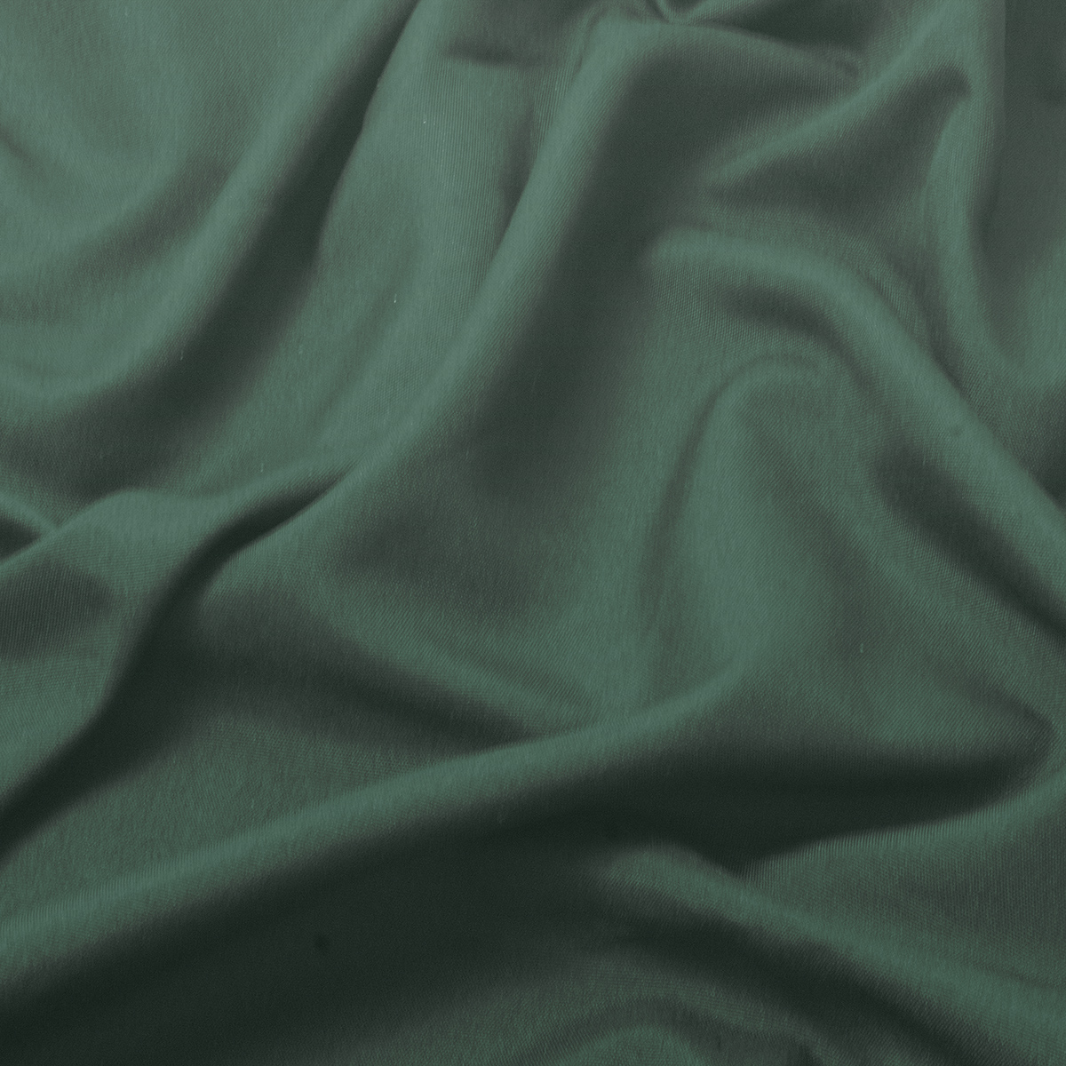 detal tkaniny z delikatną fakturą i miękkimi marszczeniami