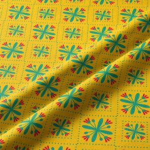 Zbliżenie na tkaninę bieżnika pokazujące turkusowe kwiatuszki i czerwone akcenty w kratkowym układzie punktów